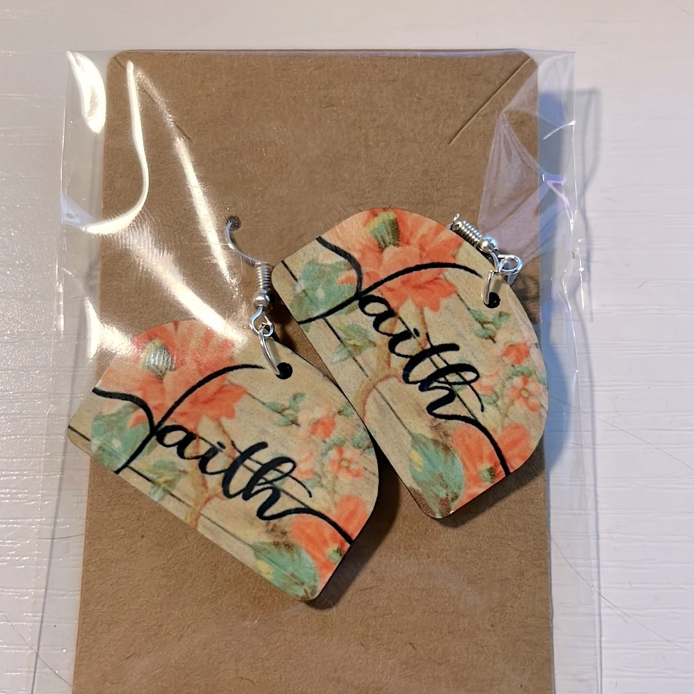 Wooden earrings sublimated with designs on them
